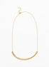 A delicate gold chain necklace featuring a textured, curved bar pendant at the bottom, displayed against a clean white background.