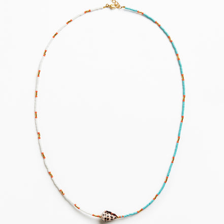 A delicate beaded necklace with turquoise blue and white beads, accented with small orange beads, featuring a central conch shell charm and a gold clasp, shown on a plain white background.