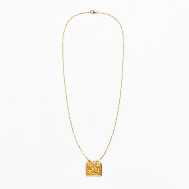 A delicate gold chain necklace featuring a small, textured square pendant, displayed against a clean white background.