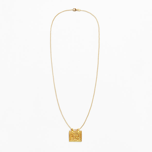 A delicate gold chain necklace featuring a small, textured square pendant, displayed against a clean white background.