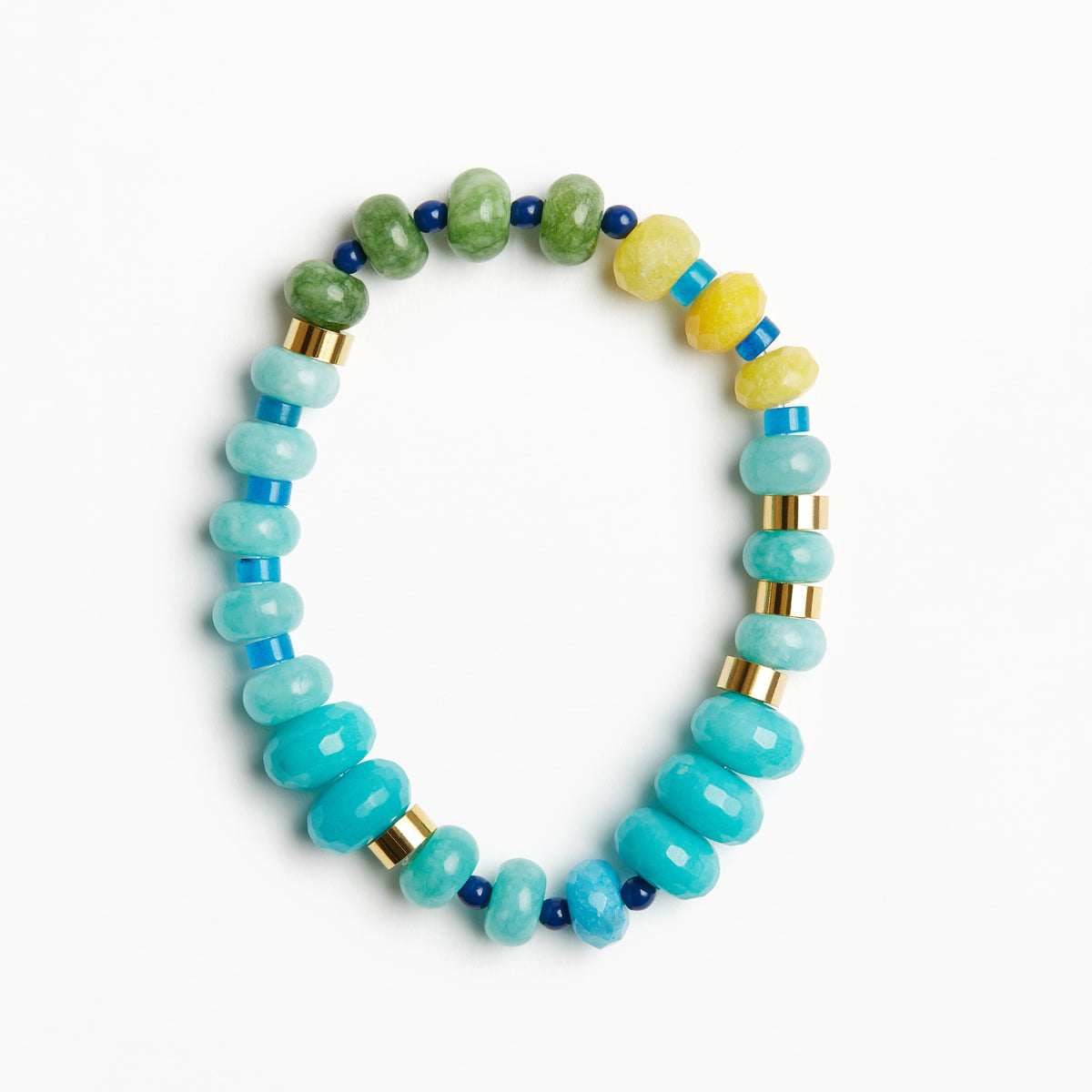 A beaded stretch bracelet featuring light blue and turquoise beads, green and yellow stone beads, and small gold spacer rings, displayed on a clean white background.