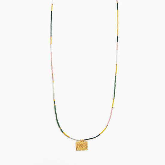 A delicate beaded necklace with a textured gold square pendant, featuring small beads in yellow, green, pink, and white, displayed against a clean white background.