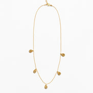 A delicate gold chain necklace featuring five small teardrop-shaped textured gold pendants spaced along the chain, displayed against a clean white background.