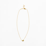 A delicate gold chain necklace with a small, textured gold heart-shaped pendant, displayed against a solid white background.